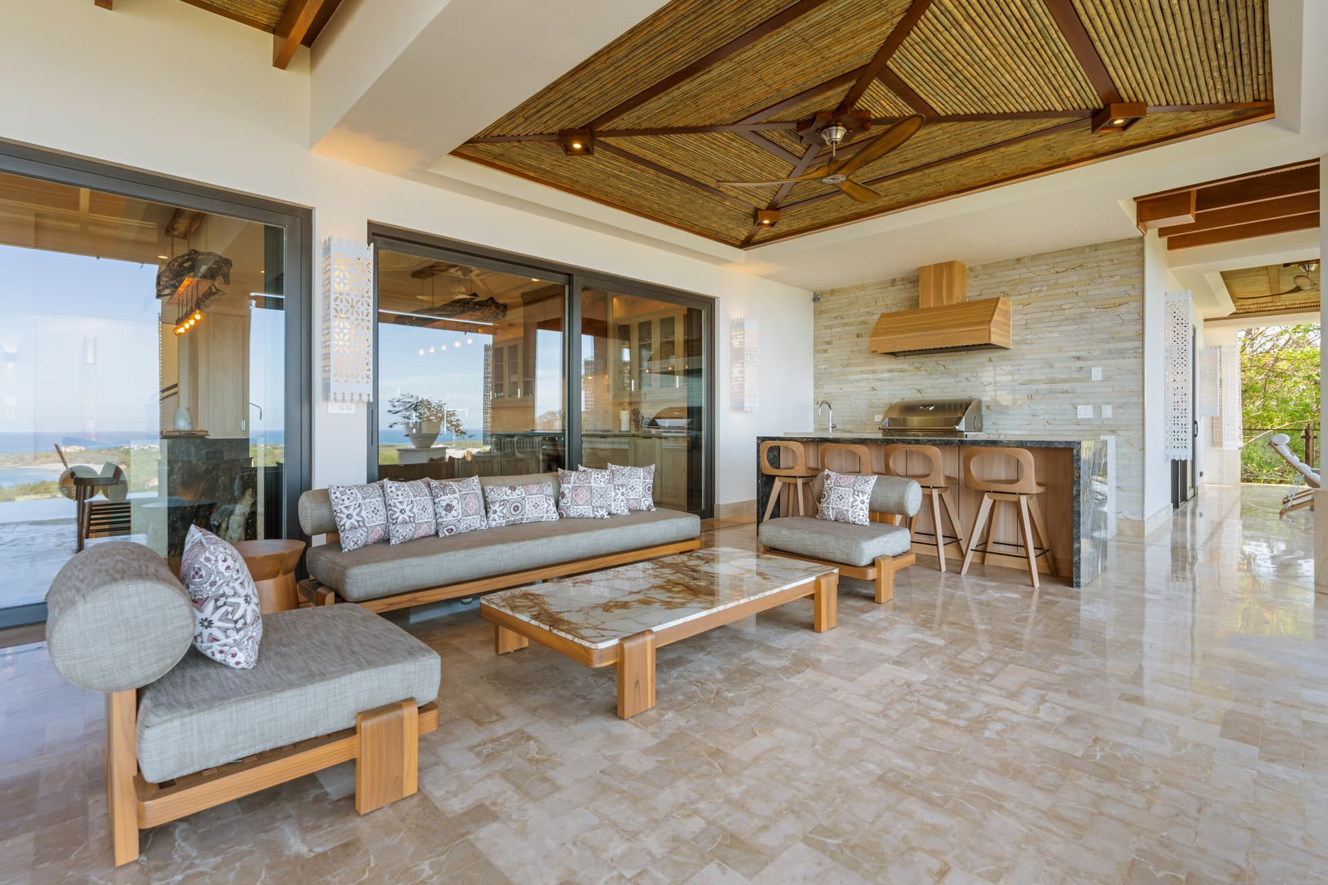Great room opening to the pool terrace