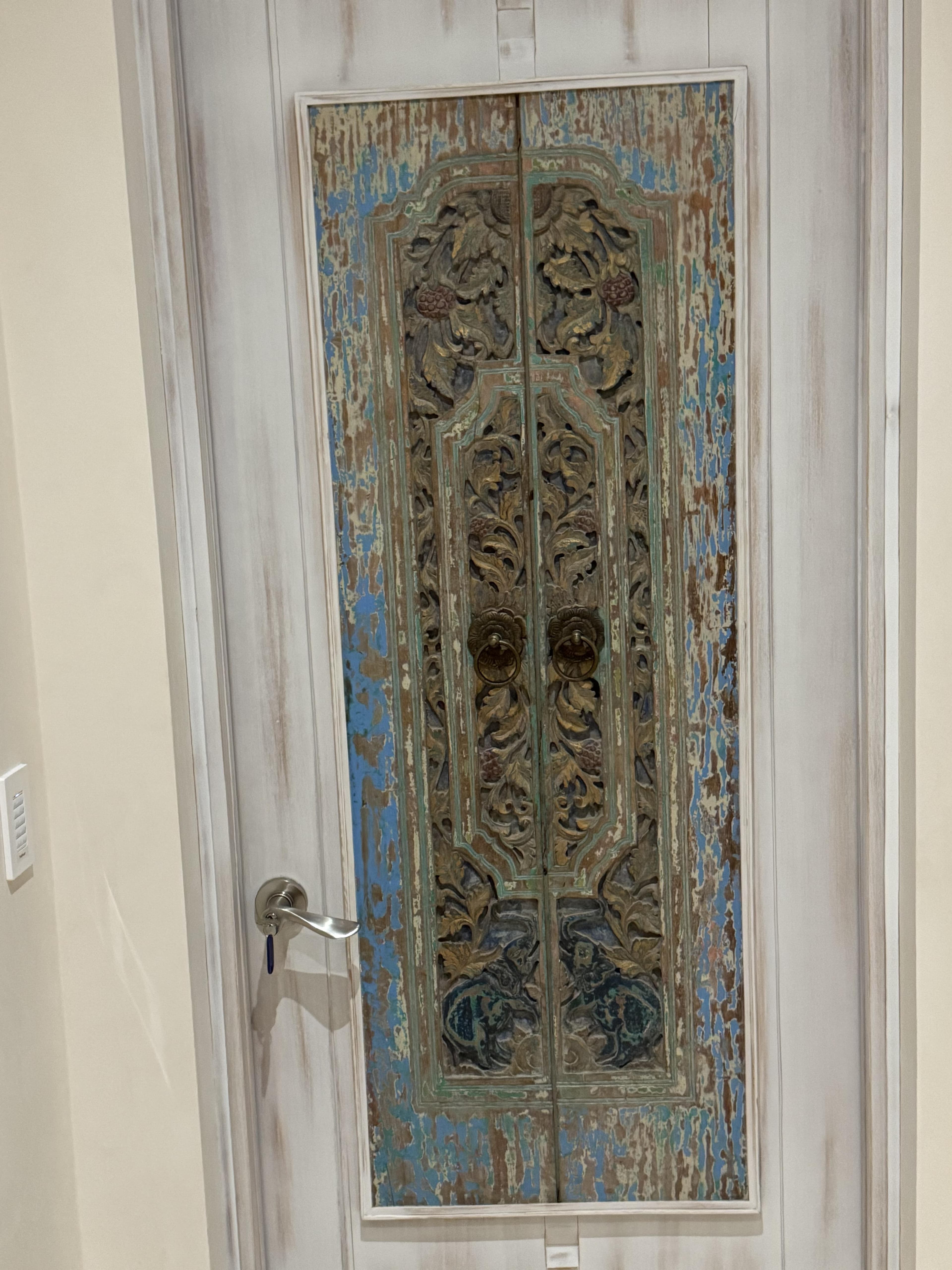 Antique Thai carved wood panel -- elephant pair, the only matched set still together, dense botanical scrollwork on teal ground