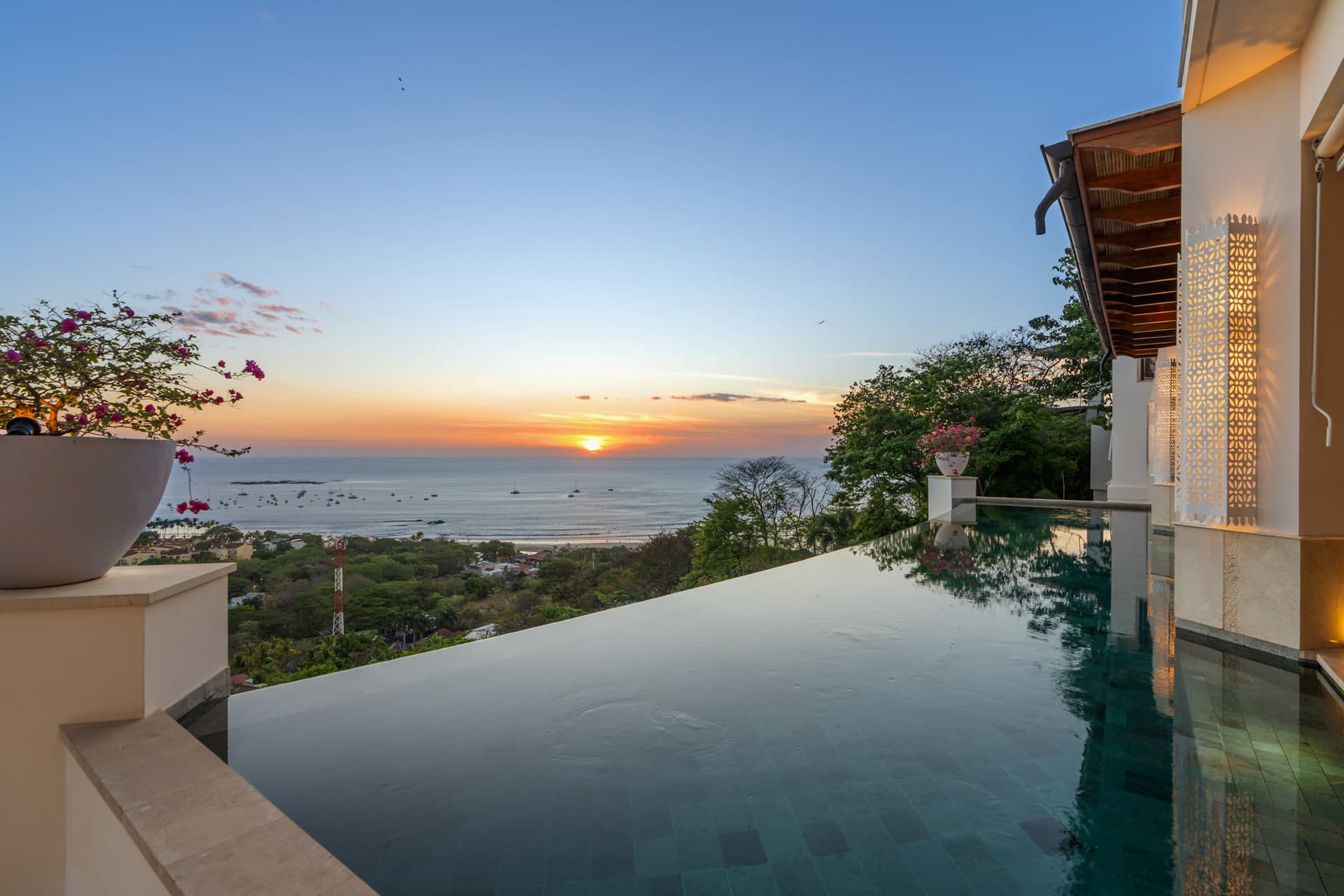 Infinity pool at sunset overlooking Tamarindo