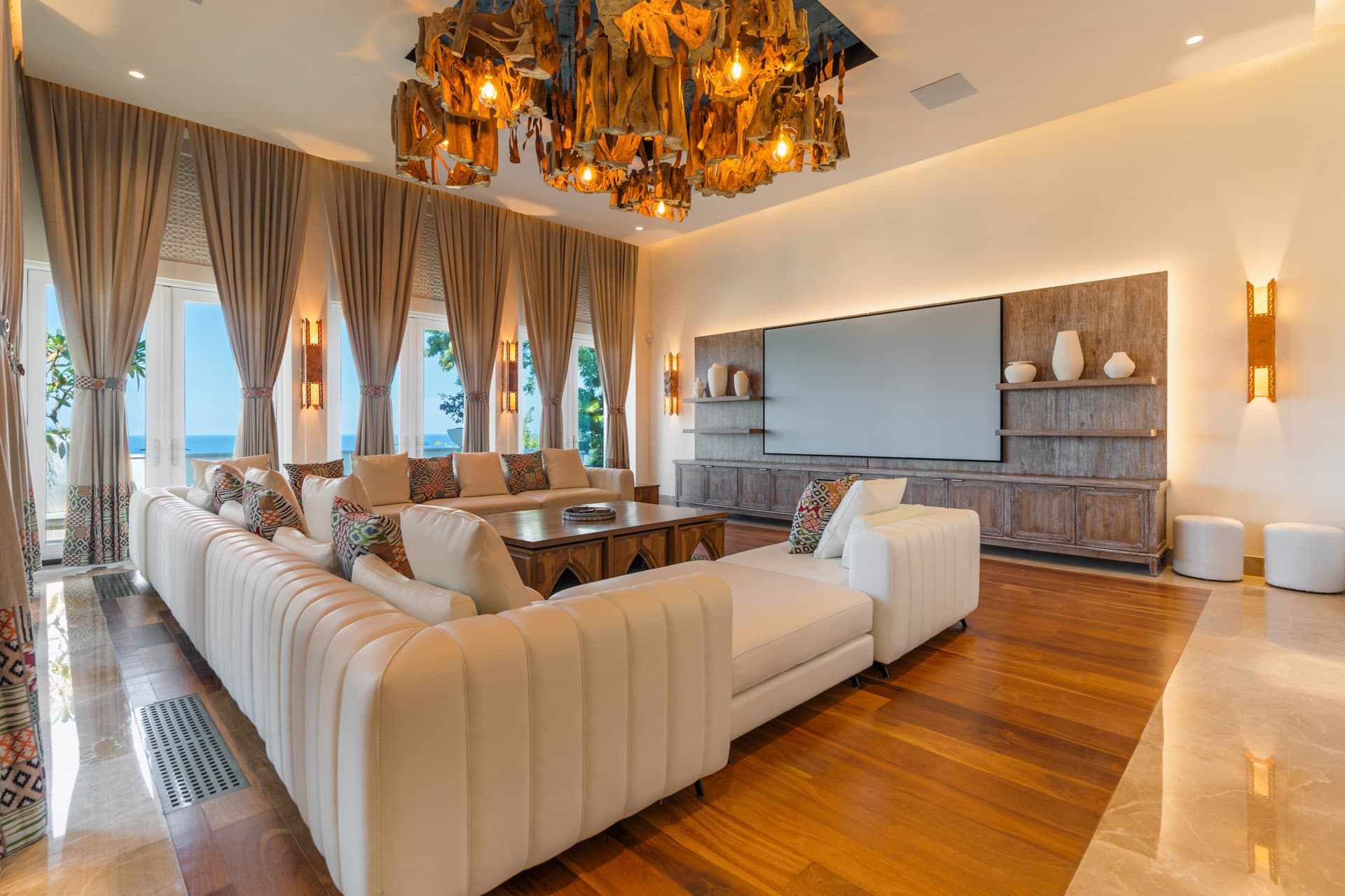 Living room — Matapalo driftwood chandelier and panoramic ocean views