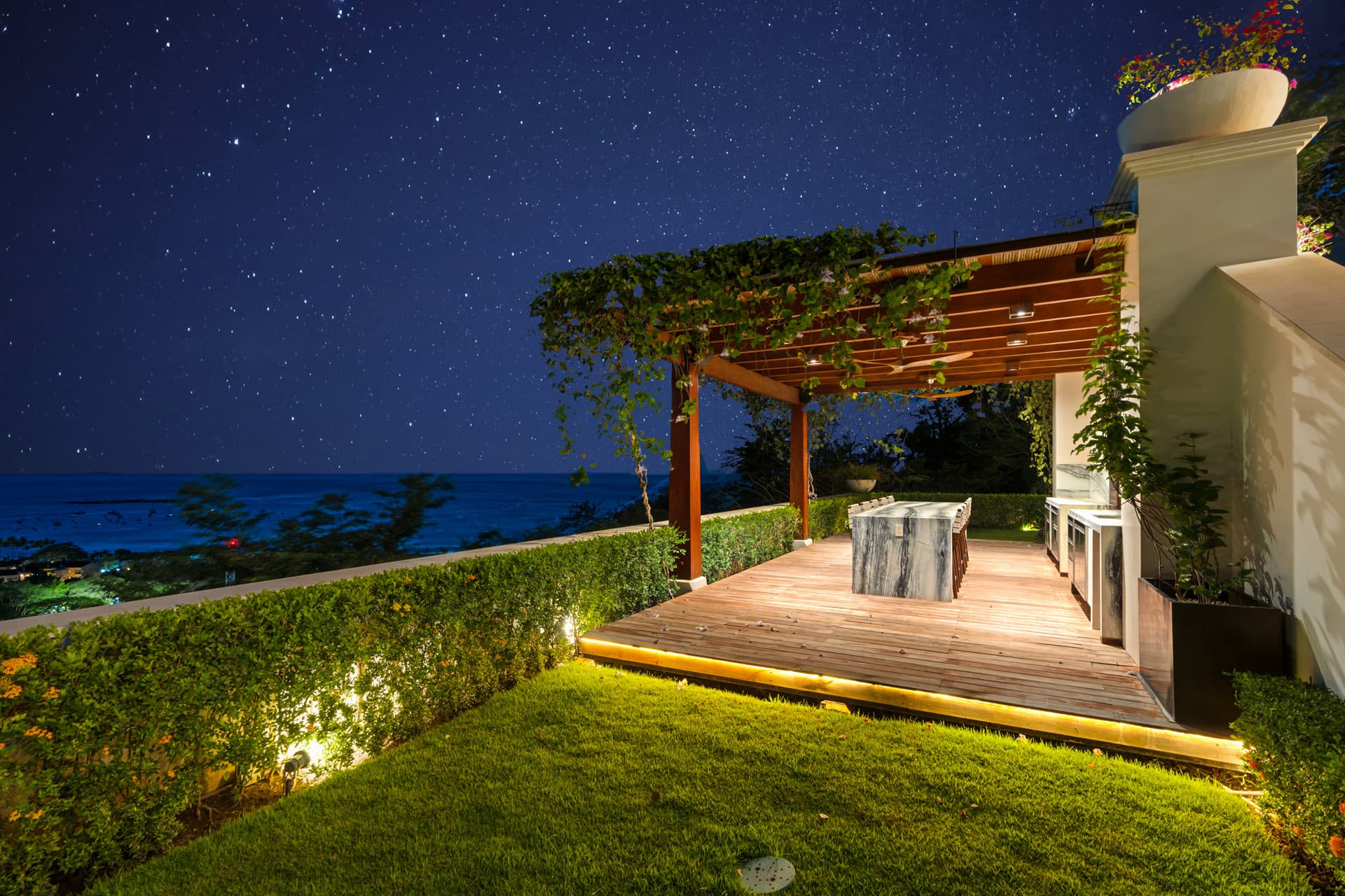 Outdoor kitchen and pergola under a starlit Costa Rican sky