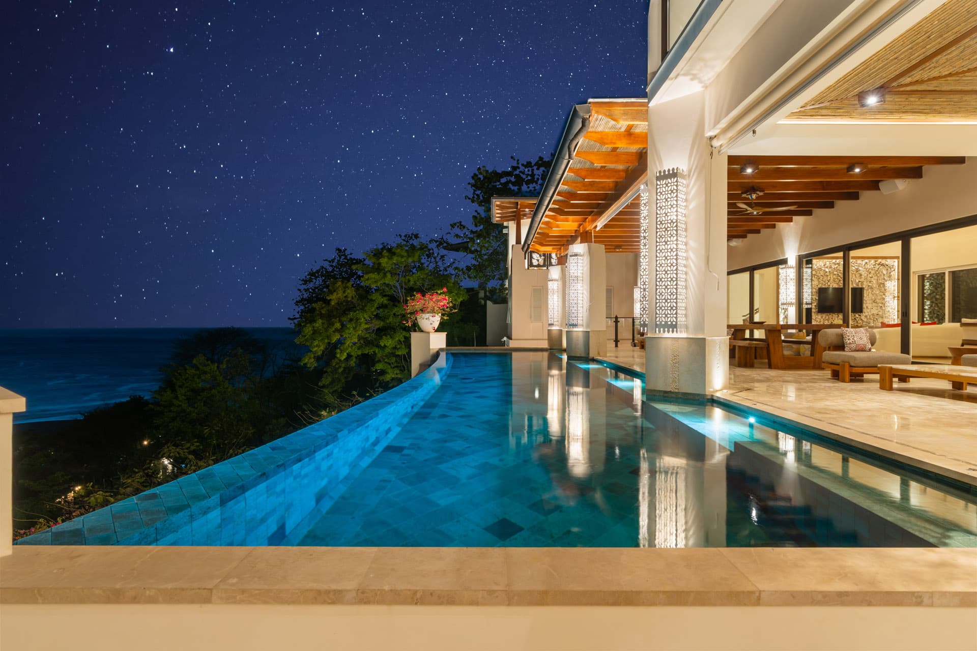 Infinity pool reflecting the Pacific night sky